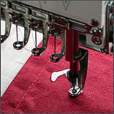 Вышивка инициалов на текстиле на заказ в процессе