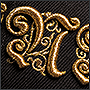 Machine 3D-embroidery with golden threads on sneps