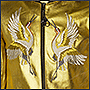 Фото вышивки журавлей на золотой кофте