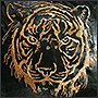 Вышивка золотой нитью тигра на коже