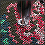 Машинная вышивка цветов крестом на рушнике в процессе