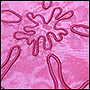 Вышивка цветка на розовой юбке, фото