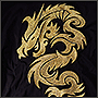 Вышивка золотого дракона на полотне под шорты