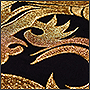 Фото вышивки золотого дракона на крое под шорты, крупный план