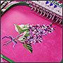 Машинная вышивка цветов на ткани под платья Ксении Князевой крупным планом