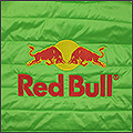Порванное место закрыто вышивкой Red Bull