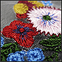 Фото вышивки цветов на сетке