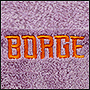 Фото вышивки на пледе логотипа Burge