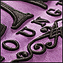 Чёрная вышивка на фиолетовом фоне