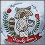 Embroidered crumb-raccoon on a sweatshirt