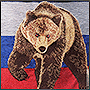 Machine embroidery of a Russian bear on a denim vest