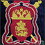 Machine embroidery of arms on velvet with metallized threads